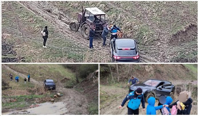 porsche blocat pe un drum forestier